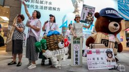 Supporters and volunteers of the recall group gather outside of a metro station shouting "Great recall, great success" in Taipei on July 22, 2025.