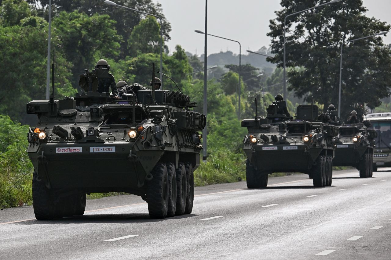 Royal Thai Army soldiers ride armored vehicles on a road in Chachoengsao province, Thailand on Thursday.