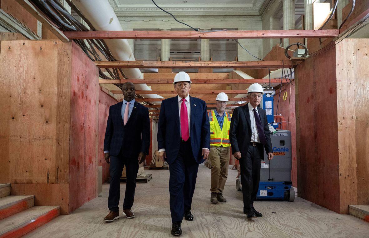 US President Donald Trump, second from left, tours the renovation site of the Federal Reserve headquarters in Washington, DC, on Thursday, July 24. He was joined by US Sen. Tim Scott, left, and Federal Reserve Chair Jerome Powell, right. The long-simmering clash between Trump and Powell <a  target="_top" href="/newspapers?url=https://www.cnn.com/2025/07/24/politics/trump-powell-federal-reserve-visit-renovation">was on full public display during the tour</a>.