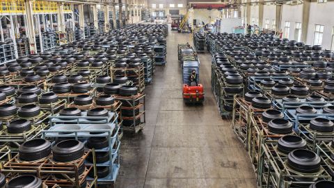 Employees work on the production line of rubber tires for export in China.