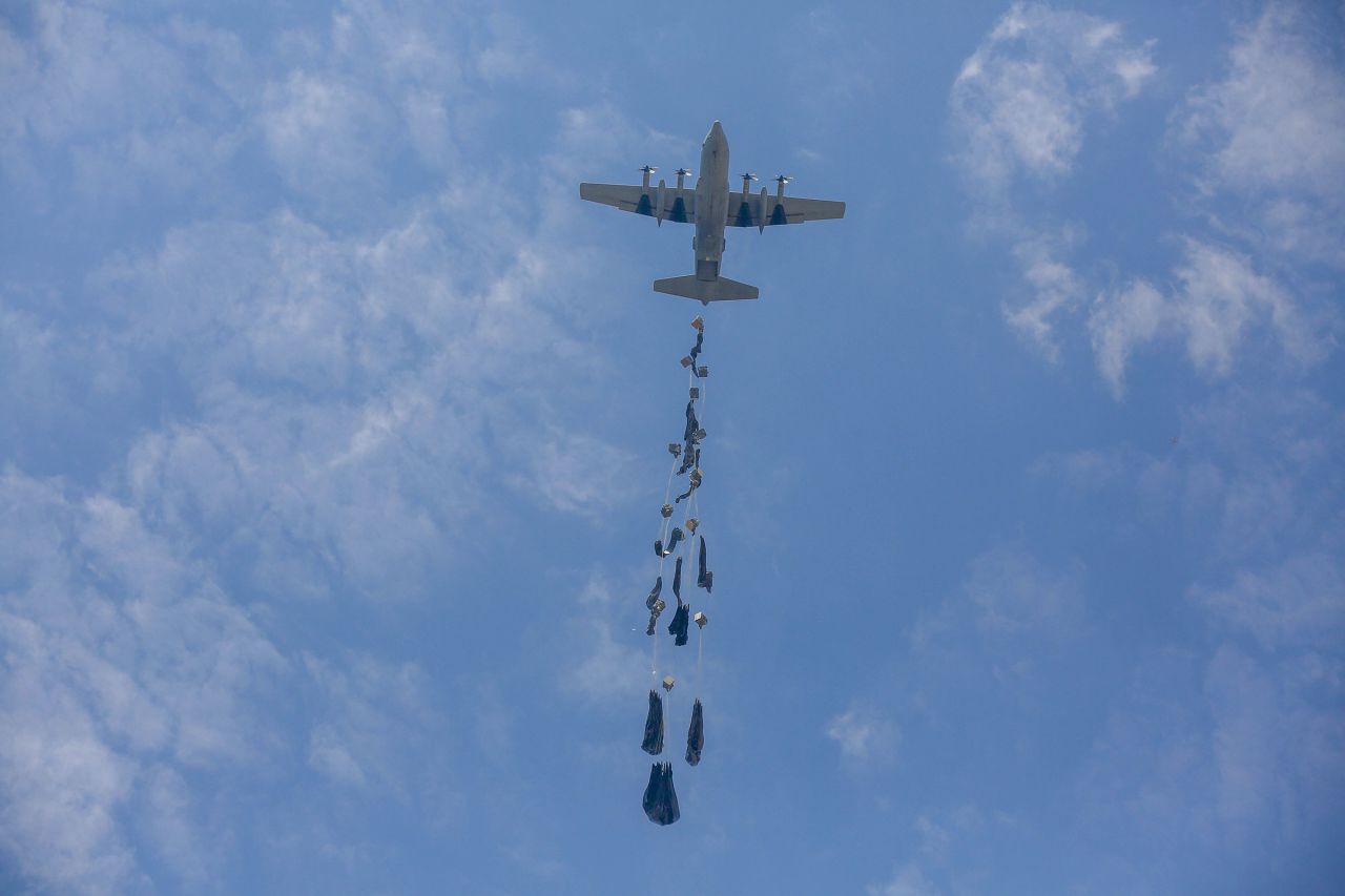 Humanitarian aid supplies are airdropped by military cargo planes over the western part of Deir al-Balah, Gaza, on Monday.
