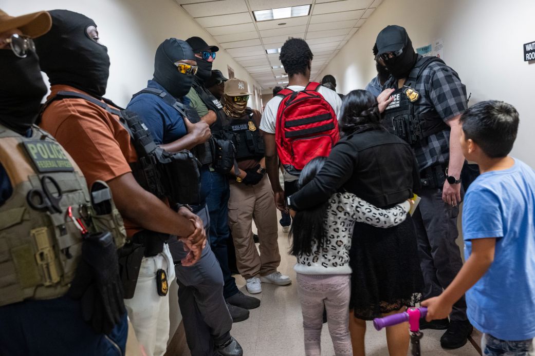 Federal agents, including members of ICE, patrol the halls of immigration court in New York City, on July 24.