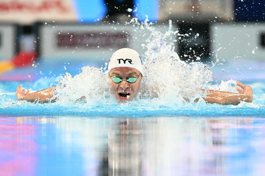 Marchand competes in the 200m individual medley semifinals at the World Aquatics Championships in Singapore.