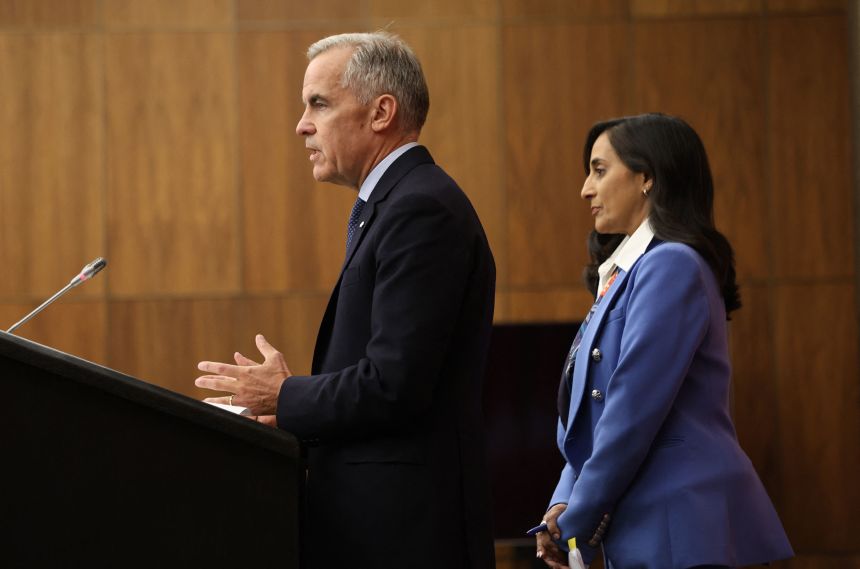 Canadian Prime Minister Mark Carney speaks, alongside Foreign Affairs Minister Anita Anand, during a press conference at the National Press Theatre in Ottawa, Ontario, Canada on Wednesday, following a Cabinet meeting.