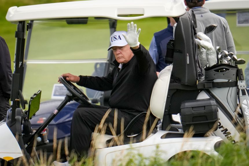President Donald Trump plays golf at the Trump Turnberry golf course on Saturday in Turnberry, Scotland.