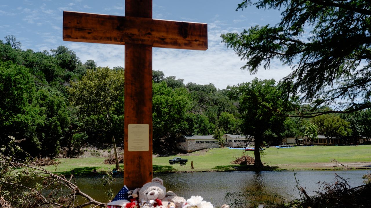 A 10-foot cross is seen along the banks of the Guadalupe River in front of Camp Mystic in Hunt, Texas, on July 18, 2025.