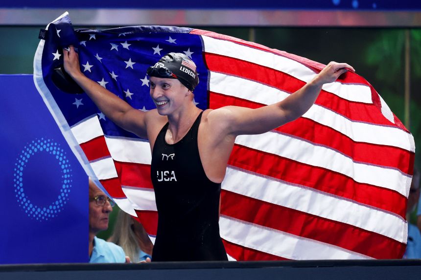 Ledecky celebrates winning gold in the 1,500m freestyle at the World Aquatics Championships.