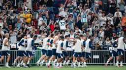 Tottenham players warm up before training at the Kai Tak Stadium in Hong Kong on Tuesday.