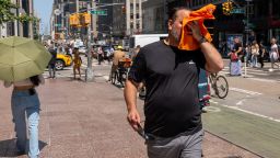 NEW YORK, NEW YORK - JULY 29: People try to stay cool on the sweltering streets of Manhattan as the region experiences another heatwave on July 29, 2025 in New York City. Temperatures are expected to reach into the high 90s with a heat index well above 100 degrees. (Photo by Spencer Platt/Getty Images)