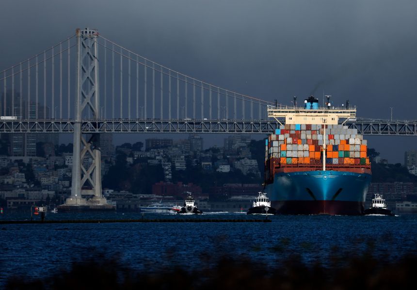 A container ship pulls into the Port of Oakland in California on Friday.