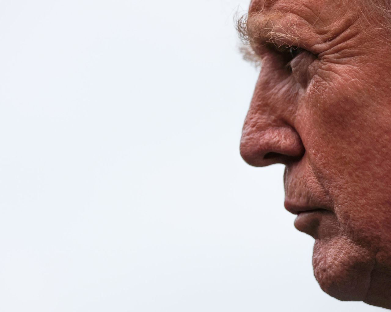 President Donald Trump speaks to the media as he departs the White House on August 1.
