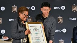 Son Heung-min and Los Angeles mayor Karen Bass hold a plaque during the unveiling of the South Korean star with MLS club LAFC.