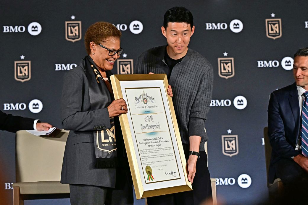 Son Heung-min and Los Angeles mayor Karen Bass hold a plaque during the unveiling of the South Korean star with MLS club LAFC.