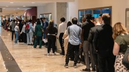 Job seekers wait in line to enter the Best Hire Chicago Career Fair on August 7.