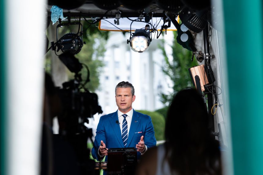 Defense Secretary Pete Hegseth speaks during a TV interview outside the White House in Washington, DC, on Thursday.
