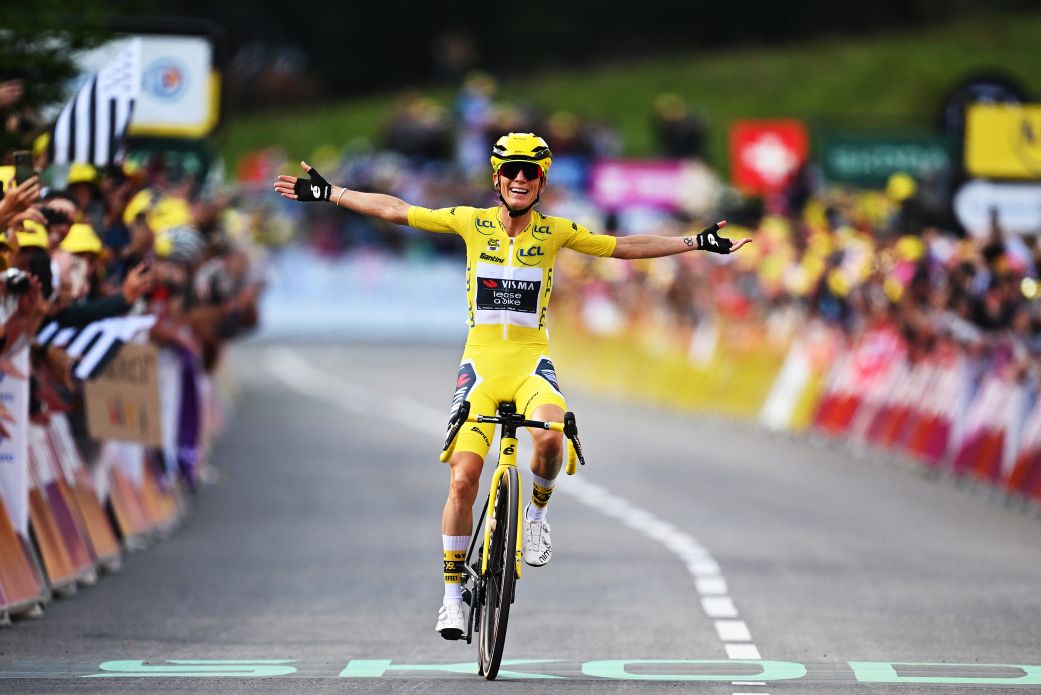 Pauline Ferrand-Prévot of France celebrates at the finish line as stage and final overall winner winner of the Tour de France Femmes.