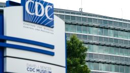 Bullet holes are seen Saturday in windows at the Centers For Disease Control Global Headquarters a day after a shooting left two dead in Atlanta.