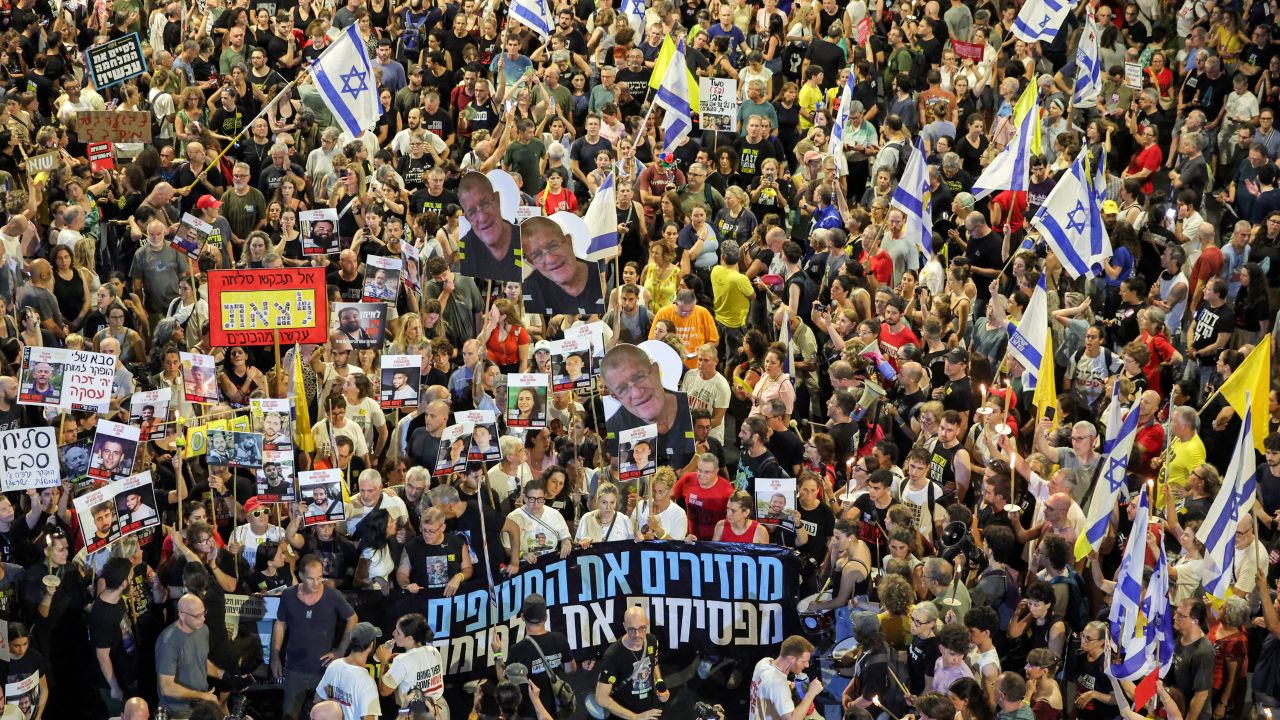 Protesters gather in a demonstration organised by the families of the Israeli hostages taken captive in the Gaza Strip since the October 2023 calling for action to secure their release outside the Defence Ministry headquarters in Tel Aviv on August 9, 2025. (Photo by Jack GUEZ / AFP) (Photo by JACK GUEZ/AFP via Getty Images)          