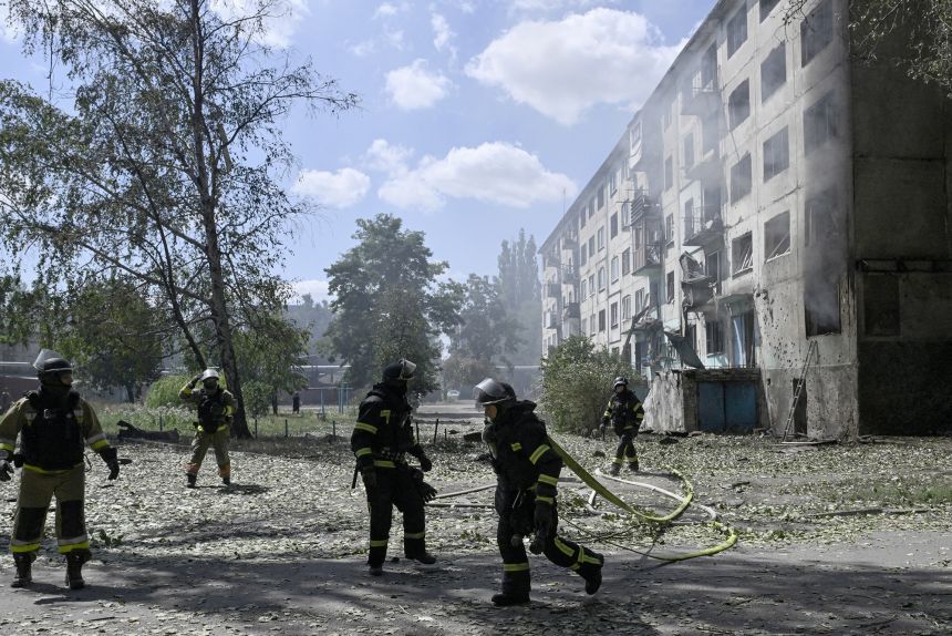 Ukrainian firefighters respond to a blaze after a Russian drone strike in the town of Bilozerske in Donetsk on Sunday.