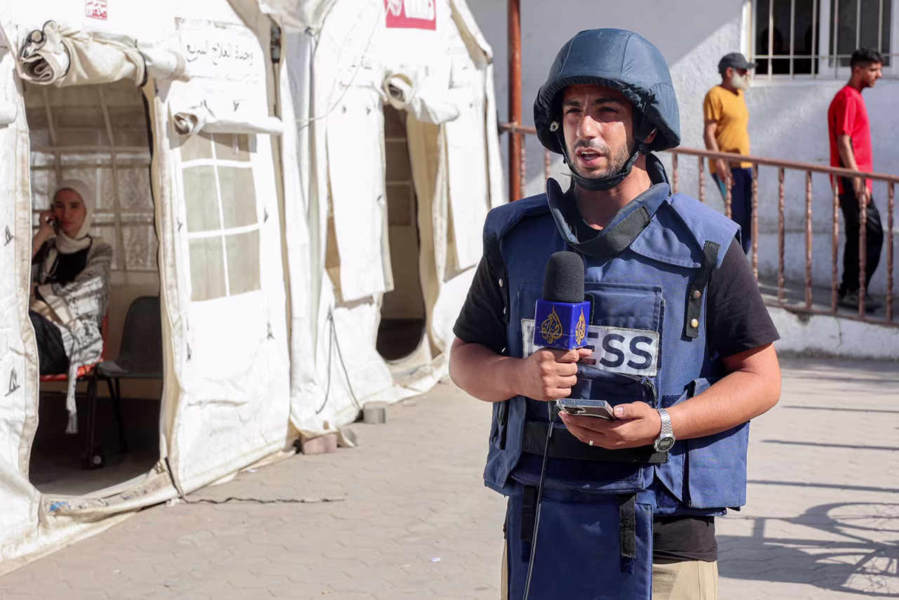 Al-Jazeera correspondent Anas al-Sharif reports near the Arab Ahli Hospital in Gaza City on October 10, 2024.