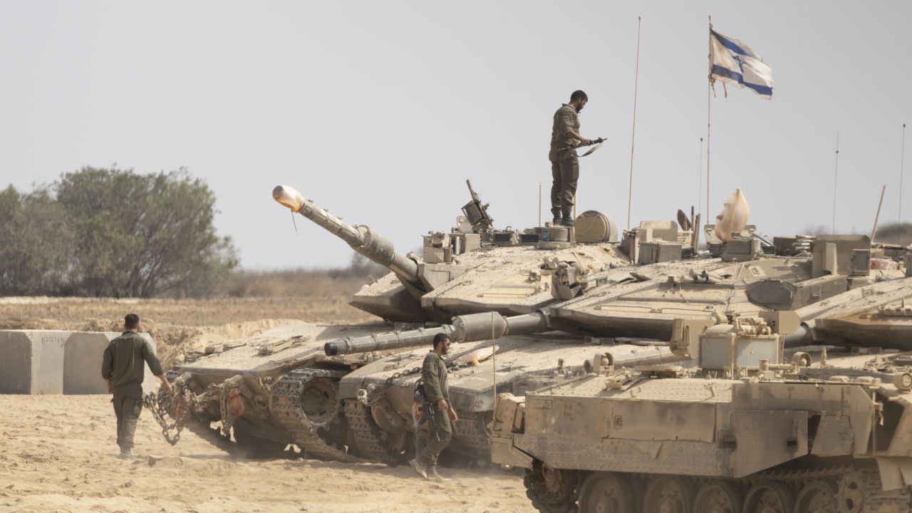 SOUTHERN ISRAEL, ISRAEL - AUGUST 13: Israeli soldiers work near tanks in a gathering point near the border with the Gaza Strip on August 13, 2025 in Southern Israel, Israel. Last week Israel's security cabinet approved Prime Minister Benjamin Netanyahu's proposal to expand IDF occupation of the Gaza Strip, including taking "complete control" of Gaza City. The planned offensive has been met with widespread condemnation by the international community, as well as hostage families, who say the move would further endanger hostages still believed to be held alive by Hamas in Gaza, as well as one million Palestinians in Gaza City, who are already facing displacement and an acute hunger crisis. (Photo by Amir Levy/Getty Images)