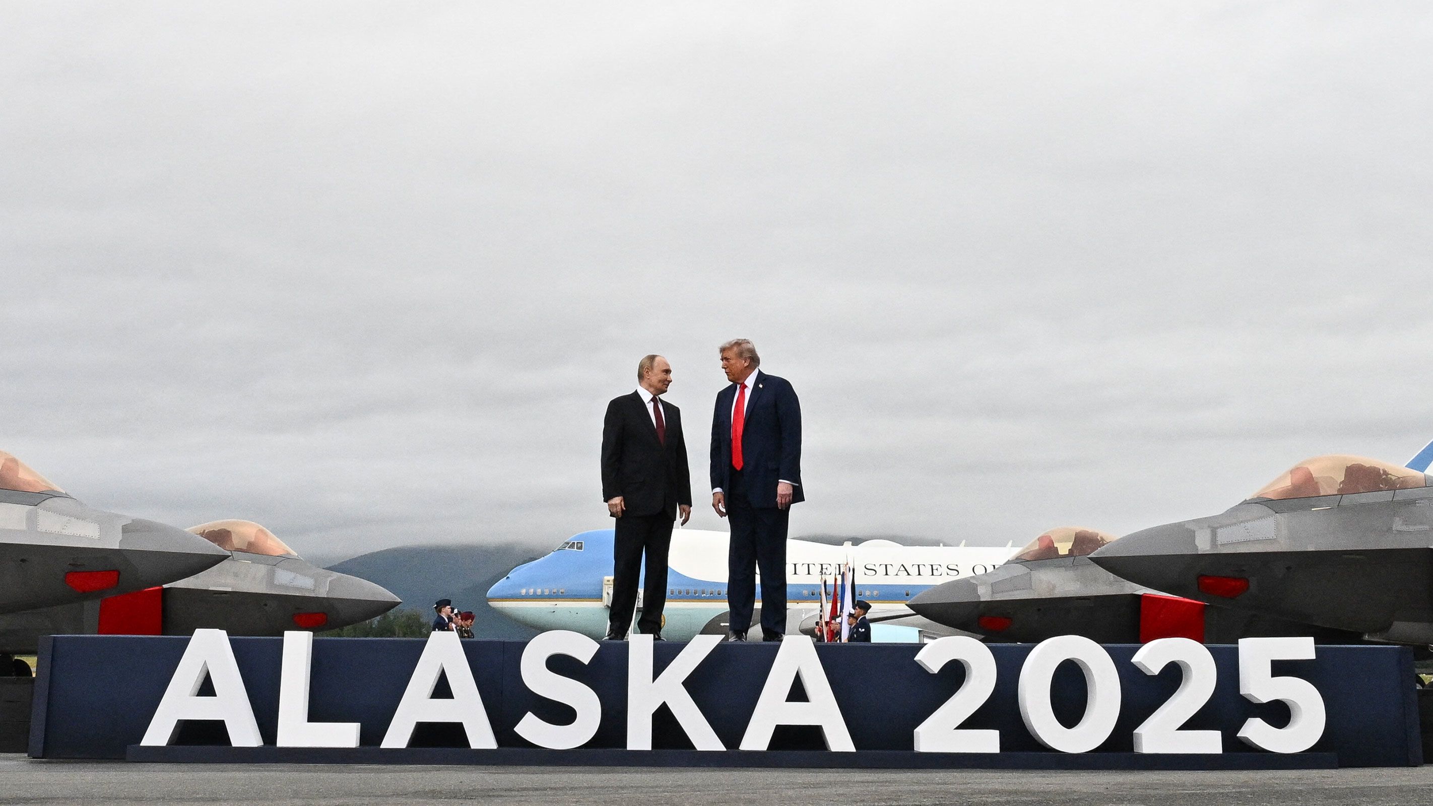 US President Donald Trump (R) and Russian President Vladimir Putin pose on a podium on the tarmac after arrival at Joint Base Elmendorf-Richardson in Anchorage, Alaska, on August 15, 2025. Putin is in Alaska at the invitation of Trump in his first visit to a Western country since he ordered the 2022 invasion of Ukraine that has killed tens of thousands of people. (Photo by Andrew CABALLERO-REYNOLDS / AFP) (Photo by ANDREW CABALLERO-REYNOLDS/AFP via Getty Images)