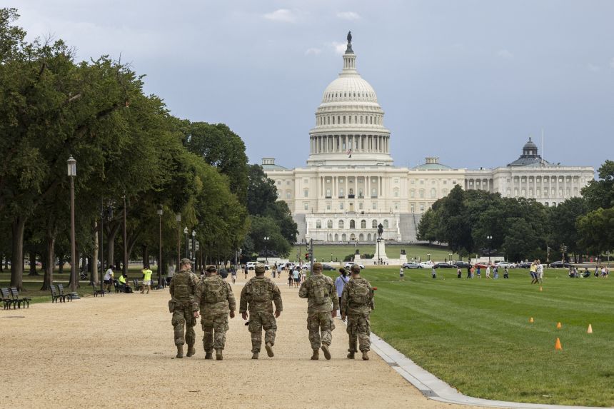 Members of the National Guard walk on the National Mall on August 14, 2025 in Washington, D.C.