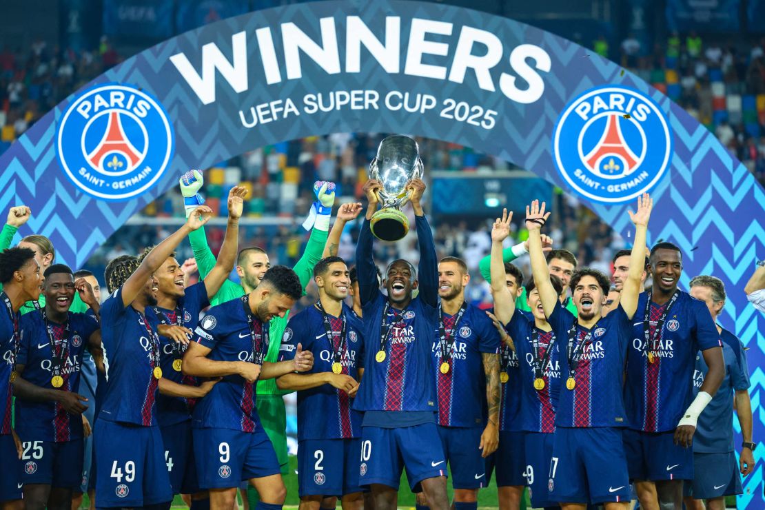 Ousmane Dembélé lifts the trophy after winning the Champions League for the first time in PSG history.