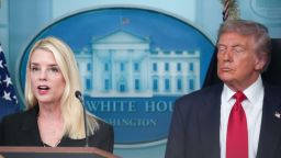 Attorney General Pam Bondi delivers remarks as US President Donald Trump looks on during a press conference at the White House on August 11, 2025.