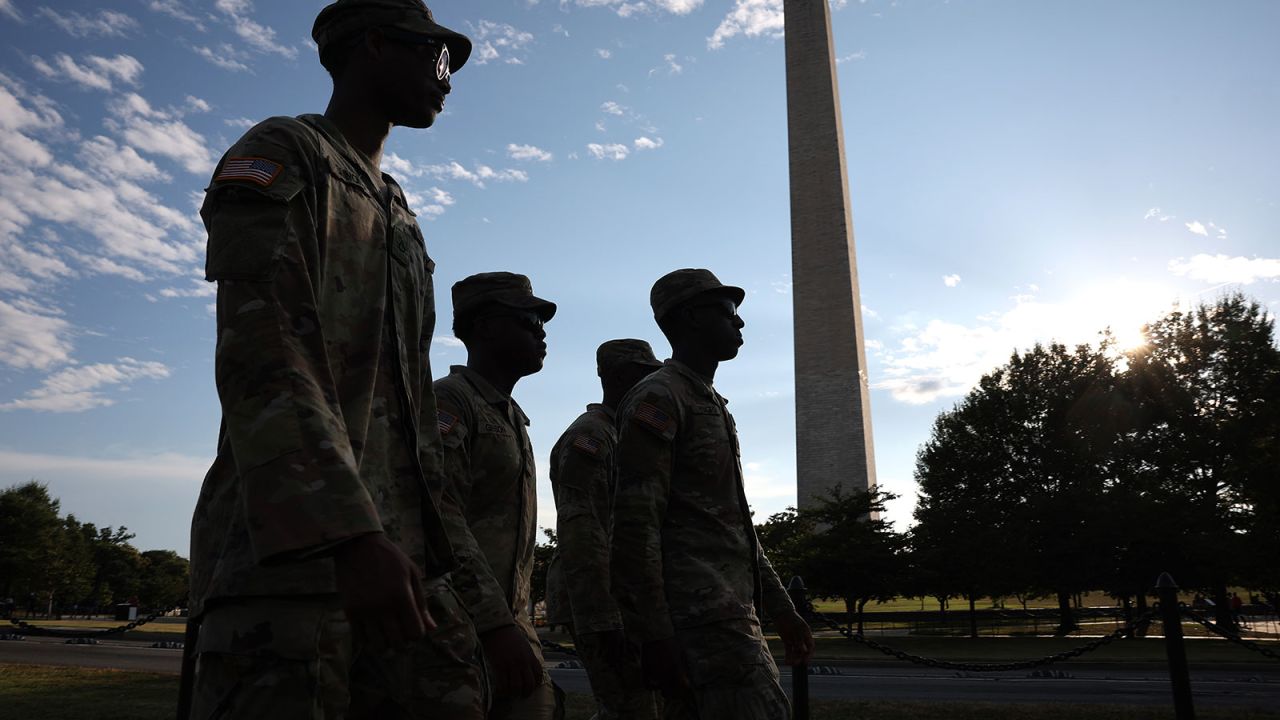 WASHINGTON, DC - AUGUST 12: Members of the Washington, DC National Guard patrol near the Washington Monument on August 12, 2025 in Washington, DC. The Trump administration has initiated a federal takeover of DC police and mobilized the DC National Guard, saying the moves are necessary to restore order in the city. City officials say they did not know about the plans in advance.  (Photo by Win McNamee/Getty Images)