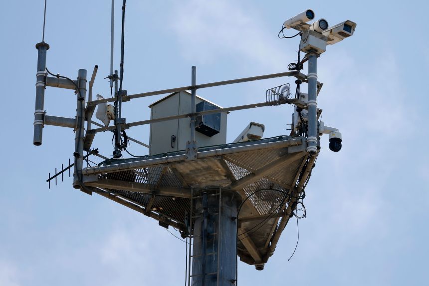 Cameras overlook the US-Mexico border wall at Border Field State Park in Imperial Beach, California, on August 17.