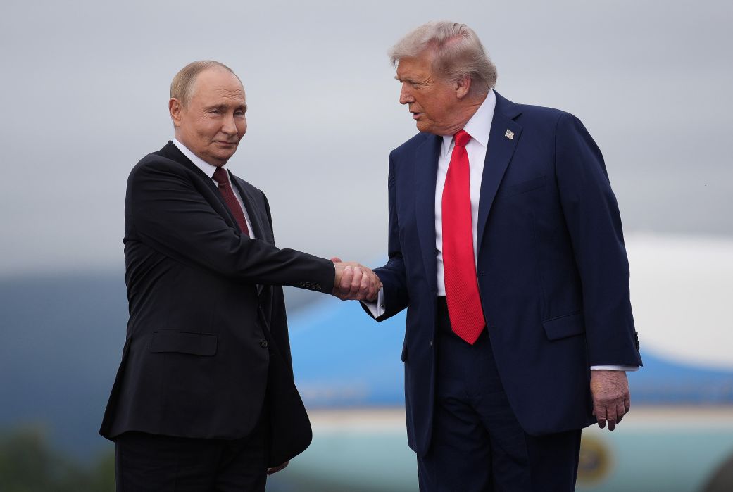 President Donald Trump (right) greets Russian President Vladimir Putin as he arrives at Joint Base Elmendorf-Richardson on August 15, 2025 in Anchorage, Alaska.