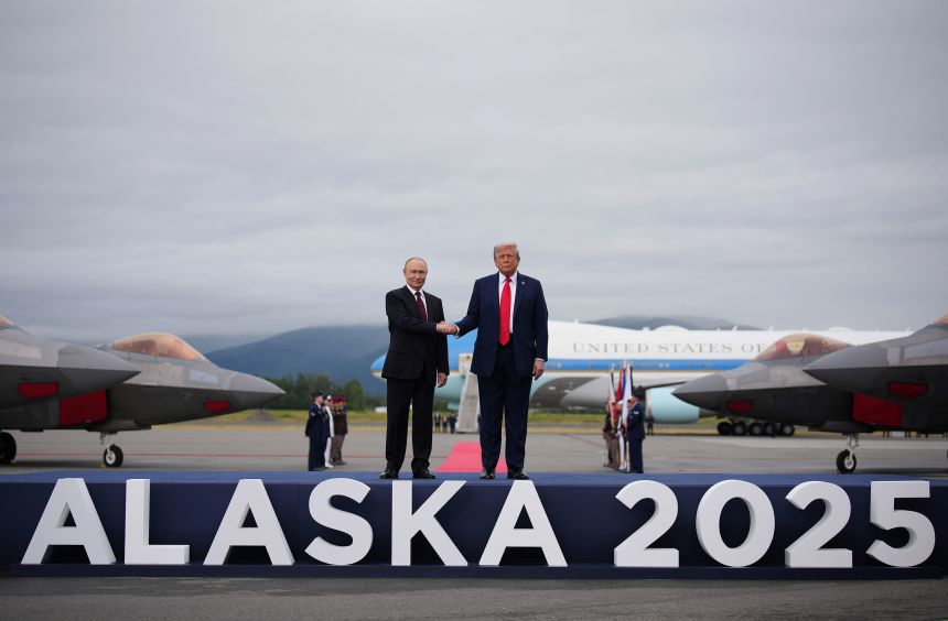 US President Donald Trump greets Russian President Vladimir Putin as he arrives at Joint Base Elmendorf-Richardson in Anchorage, Alaska on August 15.