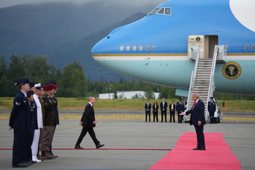 President Donald Trump greets Russian President Vladimir Putin as he arrives at Joint Base Elmendorf-Richardson on Friday in Anchorage, Alaska.