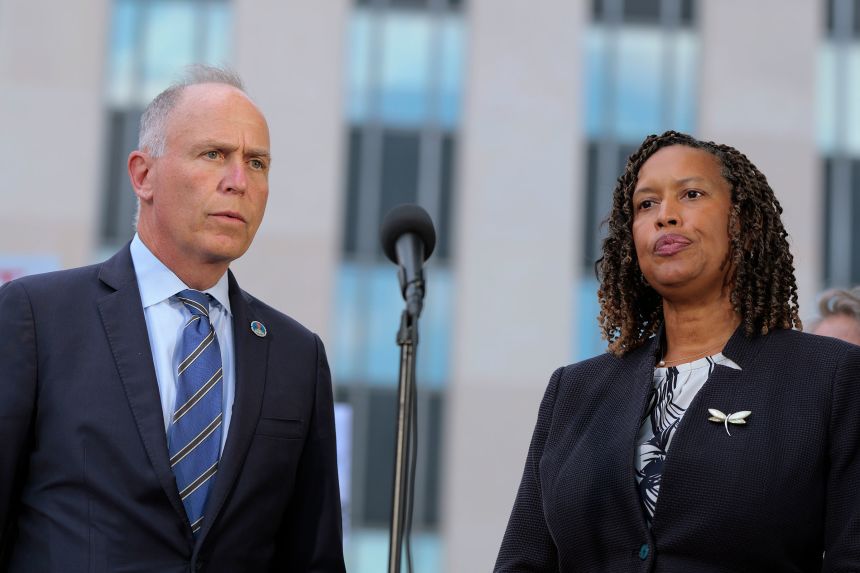 Washington, DC Attorney General Brian Schwalb and Mayor Muriel Bowser speak outside of the E. Barrett Prettyman US Court House in Washington, DC, following a court hearing on August 15, 2025.