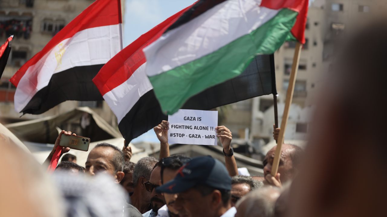 Palestinians gather in the Al-Rimal neighborhood to demand an end to Israeli attacks and forced displacement in Gaza City, Gaza, on August 21, 2025.