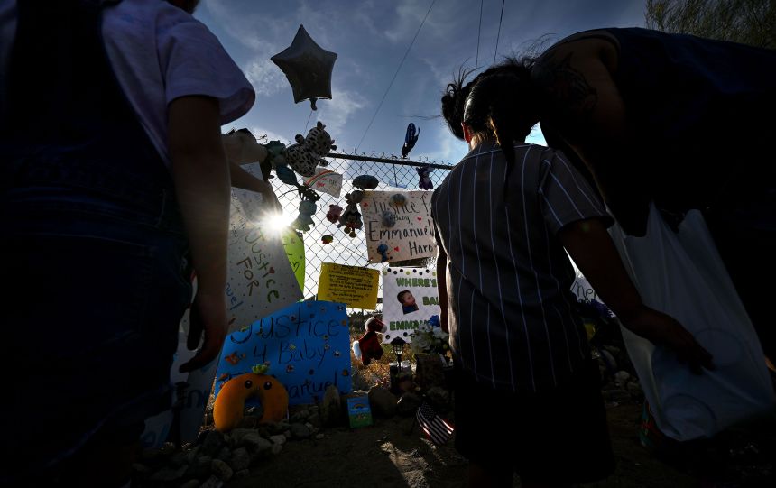 Emmanuel Haro: Parents of missing 7-month-old California boy are charged with murder 2 People gather around a makeshift memorial for Emmanuel Haro outside the boy's home in Cabazon, California, on Friday.