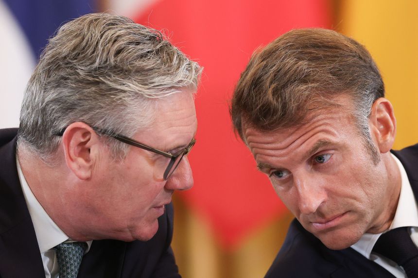 British Prime Minister Keir Starmer and French President Emmanuel Macron talk during the White House meeting on Monday.