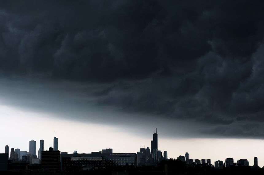 Storm clouds roll in near the Chicago skyline on August 18, 2025.