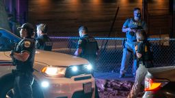 Metropolitan Police Department officers, FBI agents and an ATF agent perform a traffic stop in Washington, DC, on August 23.
