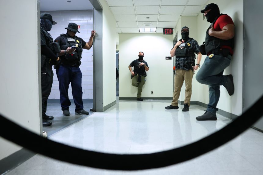 Federal agents patrol the halls of immigration court at the Jacob K. Javitz Federal Building in New York City on August 19, 2025.
