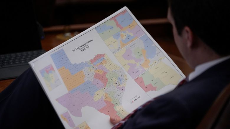 A representative looks at a congressional redistricting map during debate of a congressional redistricting plan in the House Chamber at the Texas State Capitol in Austin, on August 20, 2025.