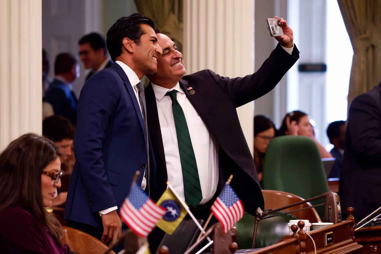 Speaker of the Assembly Robert Rivas, left, takes a photo with Democratic Assembly member Ash Kalra during a meeting of the California State Assembly on Thursday.