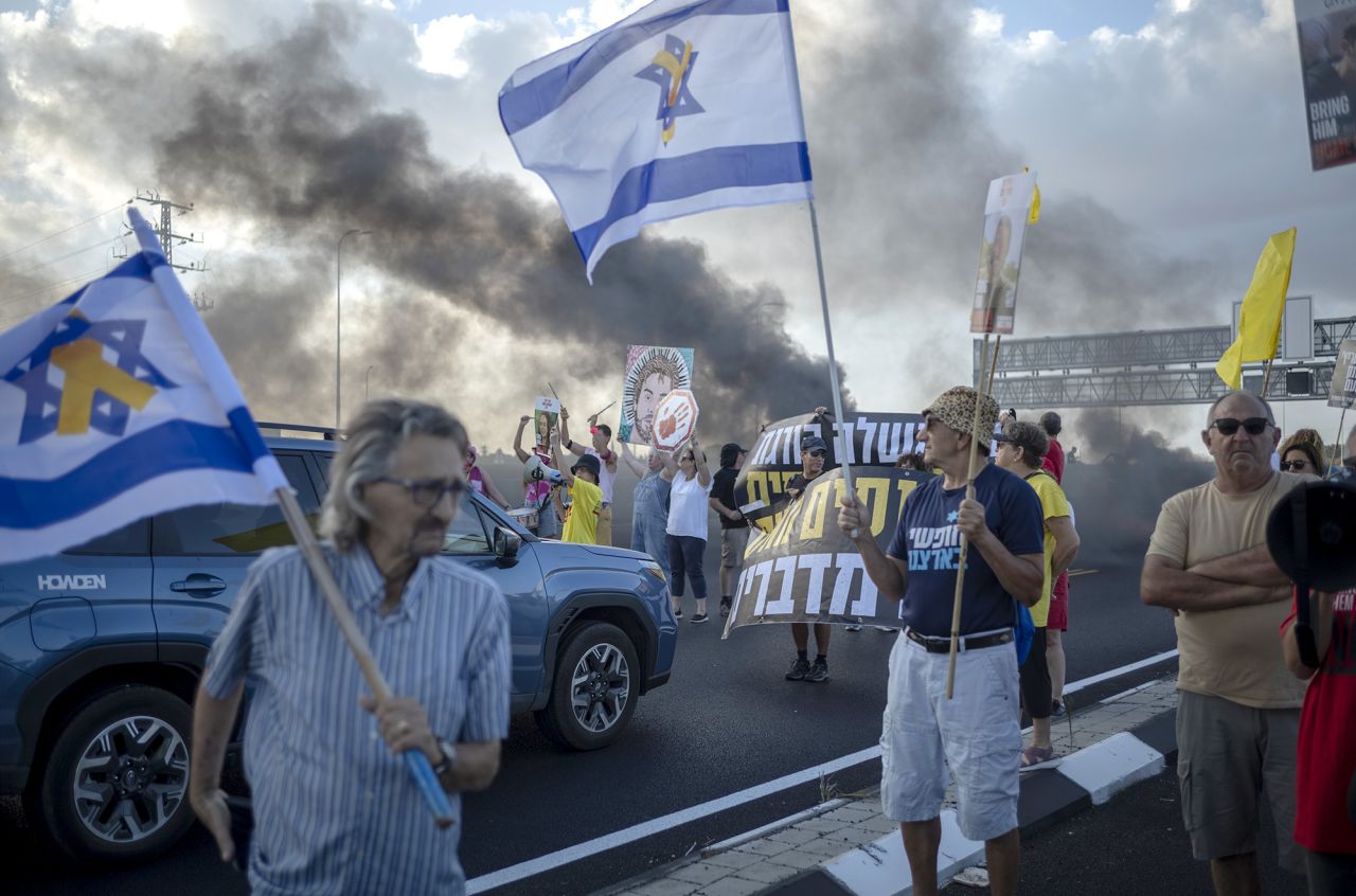 Israeli protesters block the main highway in Tel Aviv as they demand the immediate release of the hostages and an end to the war