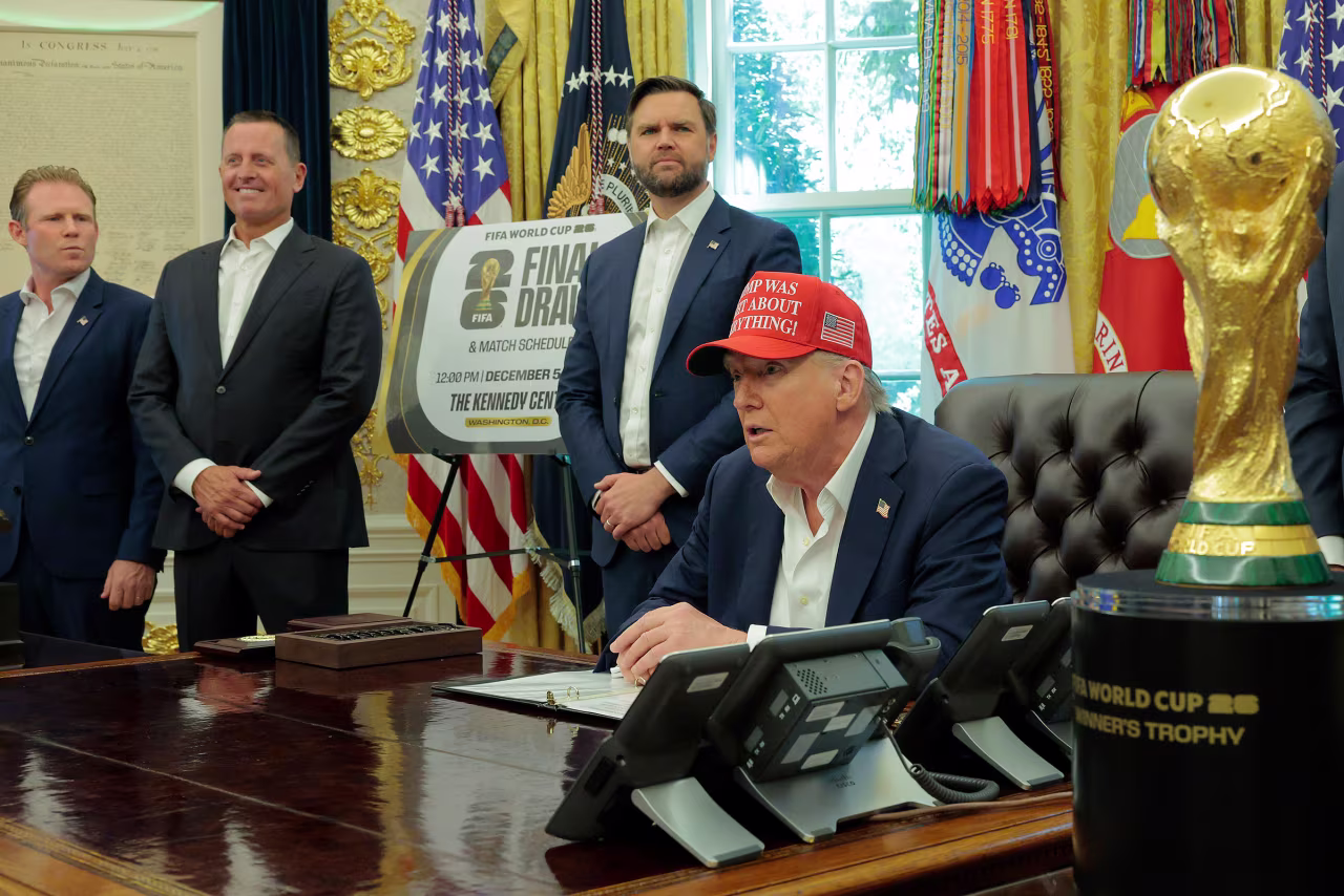 President Donald Trump speaks in the Oval Office, alongside FIFA President Gianni Infantino, right, and Vice President JD Vance, on Friday.