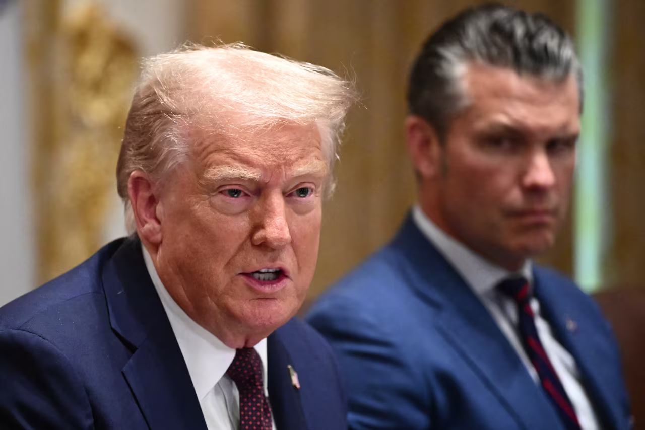 President Donald Trump, alongside Secretary of Defense Pete Hegseth, speaks during a cabinet meeting in August.