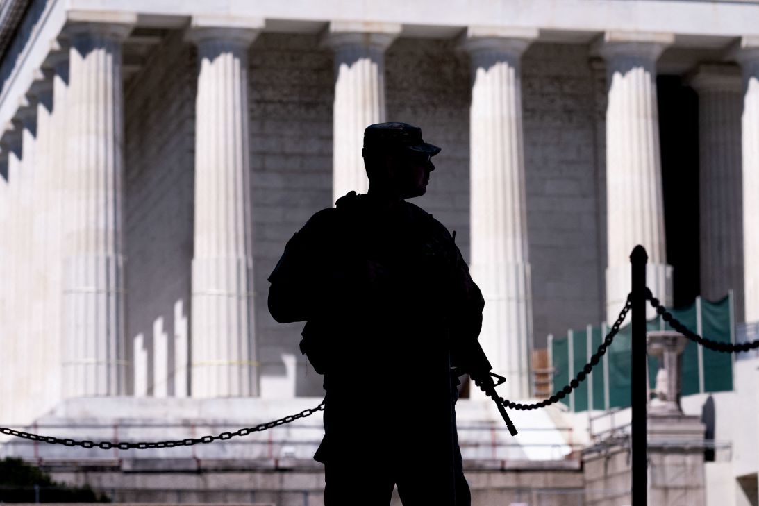 An armed member of the National Guard patrols near the Lincoln Memorial, on the National Mall in Washington, DC, on Tuesday.
