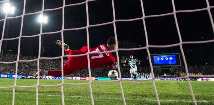 Almaty's Temirlan Anarbekov makes a save during a penalty shootout against Celtic.