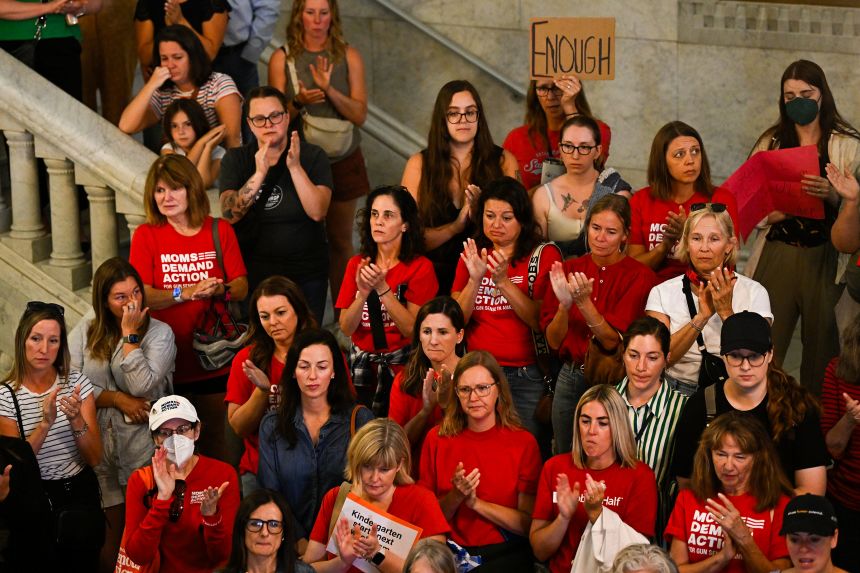 Members of Moms Demand Action attend a press conference with city officials and gun legislation advocates following a mass shooting at Annunciation Catholic School on Thursday.