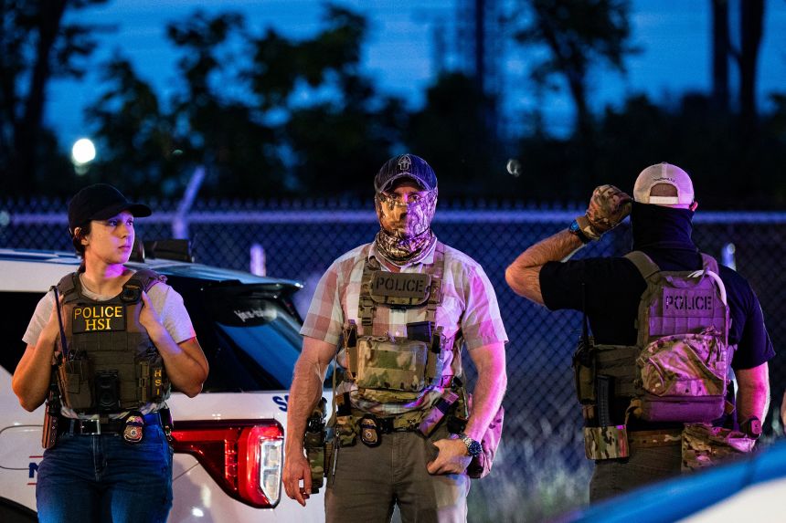 Federal law enforcement agents operate a traffic checkpoint in the Ivy City neighborhood of Washington, DC, on August 28.